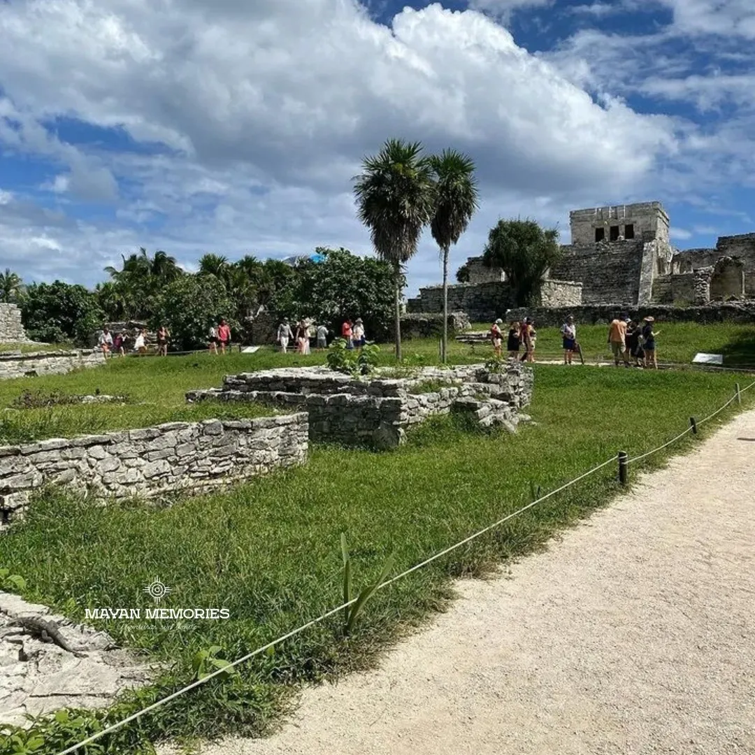 Tulum ruins on the lawn among palm trees