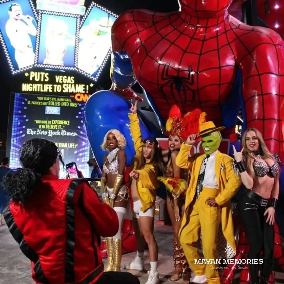 Costumed characters posing with guests at the entrance