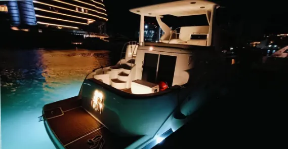 Meridian yacht at night with its deck lit up