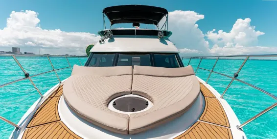 Yacht bow with teak deck and the flybridge behind