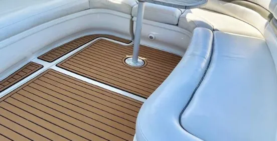 White seating and teak floor on the deck