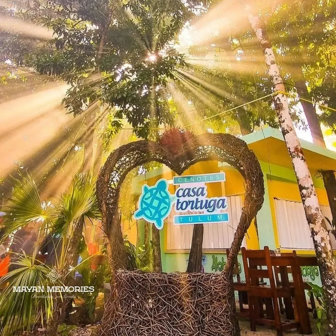 Casa Tortuga sign in a wooden heart with rays of sunlight