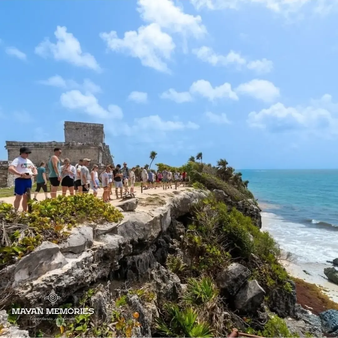 Visitors on the clifftop path in Tulum