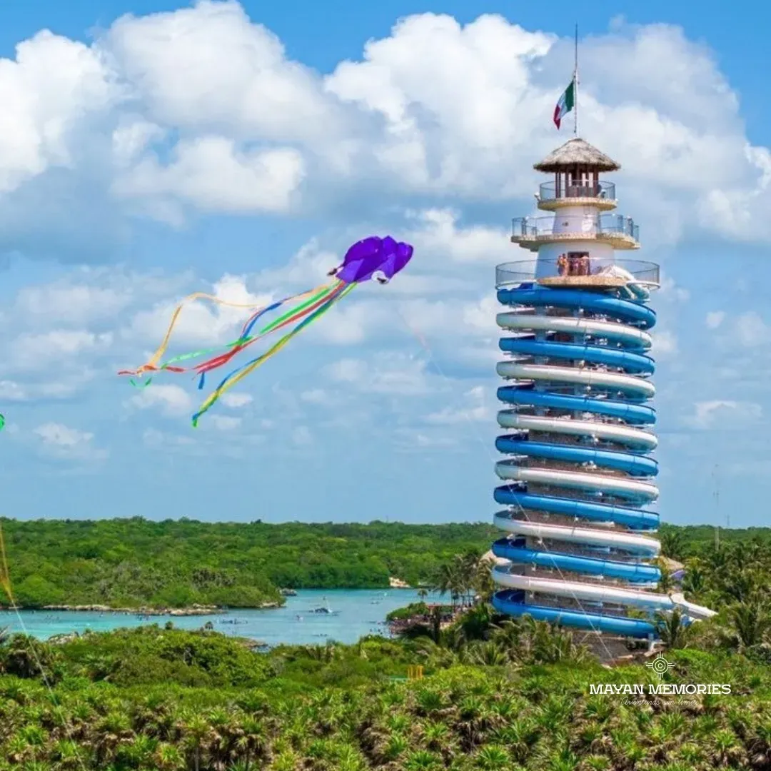Xel-Há's blue-striped El Faro lookout with a kite